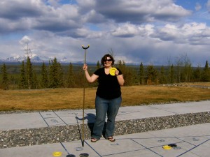 Shuffleboard player showing equipment with a smile