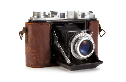 retro camera with leather look and lens door open