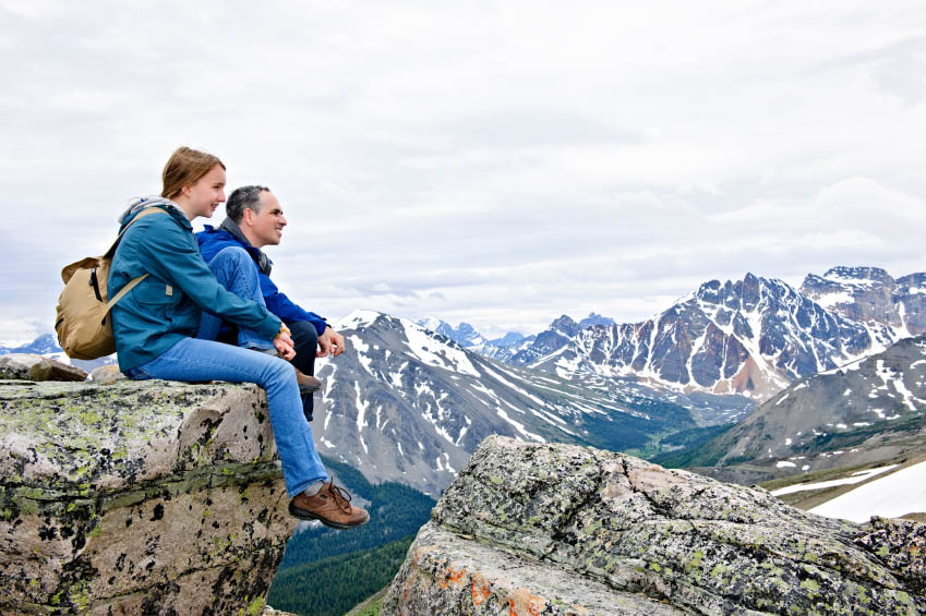 Father and daughter in mountains