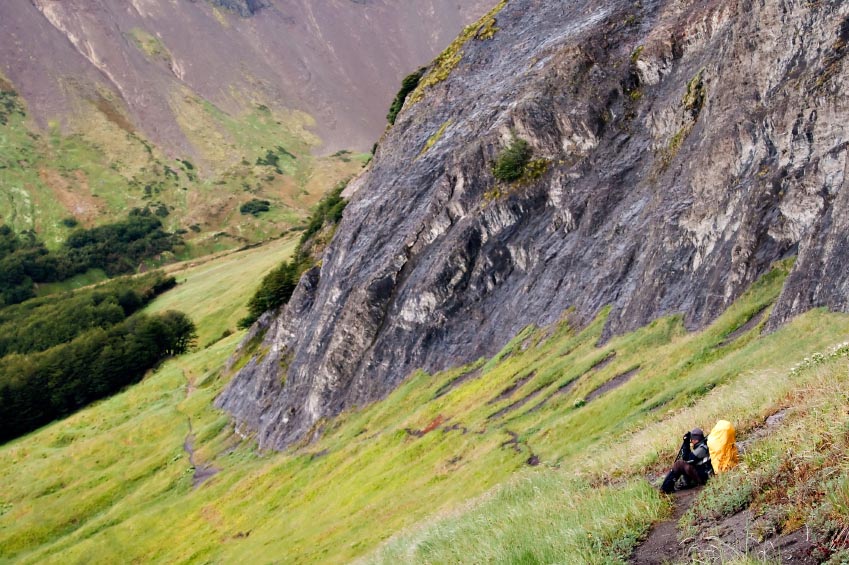 Hiker on a mountainside trail