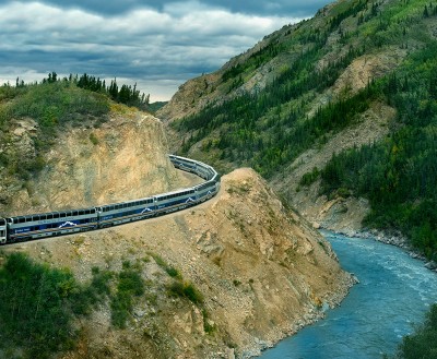 Alaska Rail Tour on hillside overlooking a river