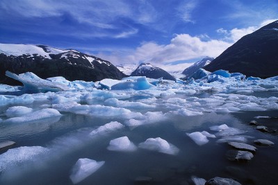 Icy lake in alaska with mountains in the distance