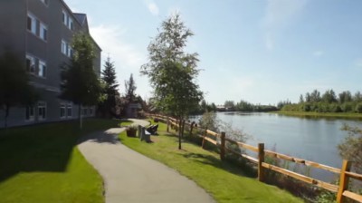 Winding paved path along the river