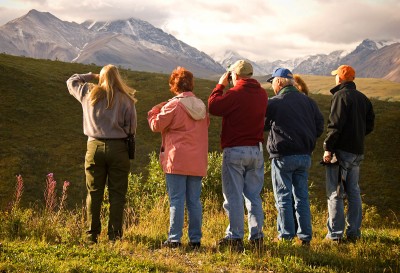 Alaska Tourists Taking Pictures of the Mountain with Tour Guide