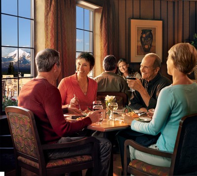 Friends enjoying dinner at the Whistle Stop Bar & Grill at the Copper River Princess Wilderness Lodge