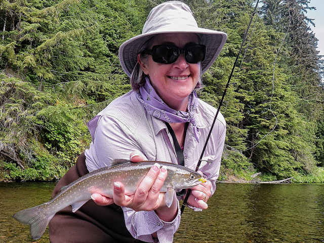 A fisherwoman holds her catch