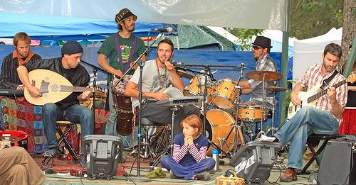 A group of musicians performs on stage