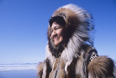 A Native Alaskan in cold weather dress.