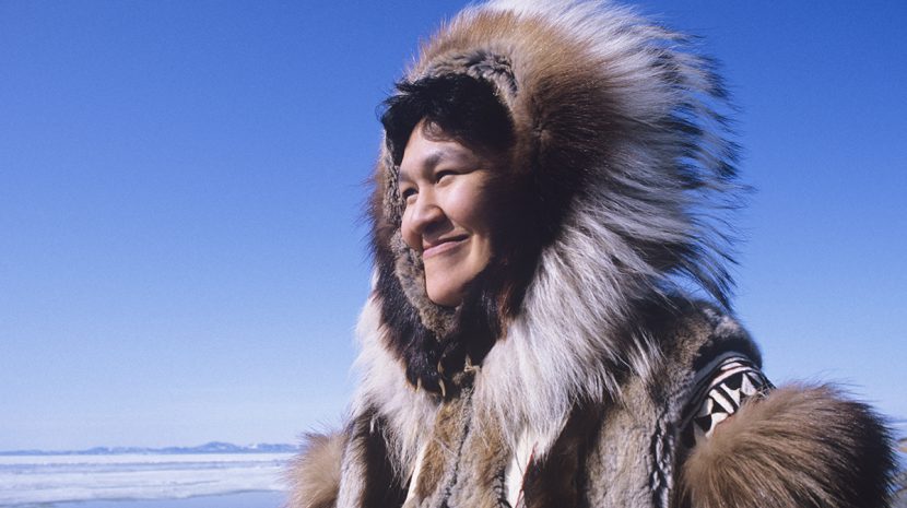 A Native Alaskan in cold weather dress.