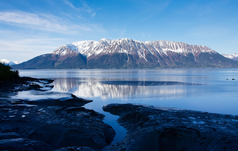 Low tide of Turnagain Arm with mountain in the background.