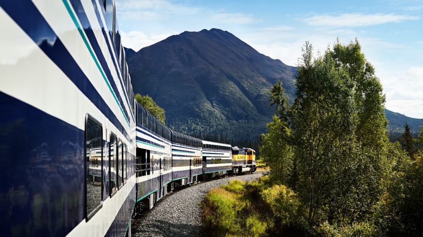 Princess Rail Cars traveling around a bend